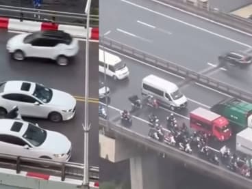 Vietnam Drivers Form Barricade Around Motorcyclists To Protect Them From Typhoon Yagi Winds