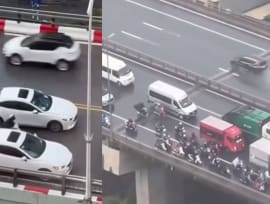 Vietnam Drivers Form Barricade Around Motorcyclists To Protect Them From Typhoon Yagi Winds