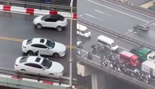 Vietnam Drivers Form Barricade Around Motorcyclists To Protect Them From Typhoon Yagi Winds